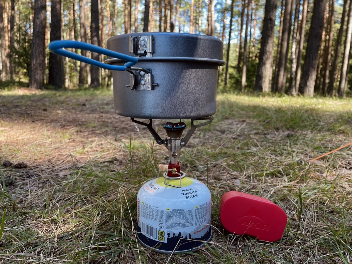 gas stove in forest with water boiling