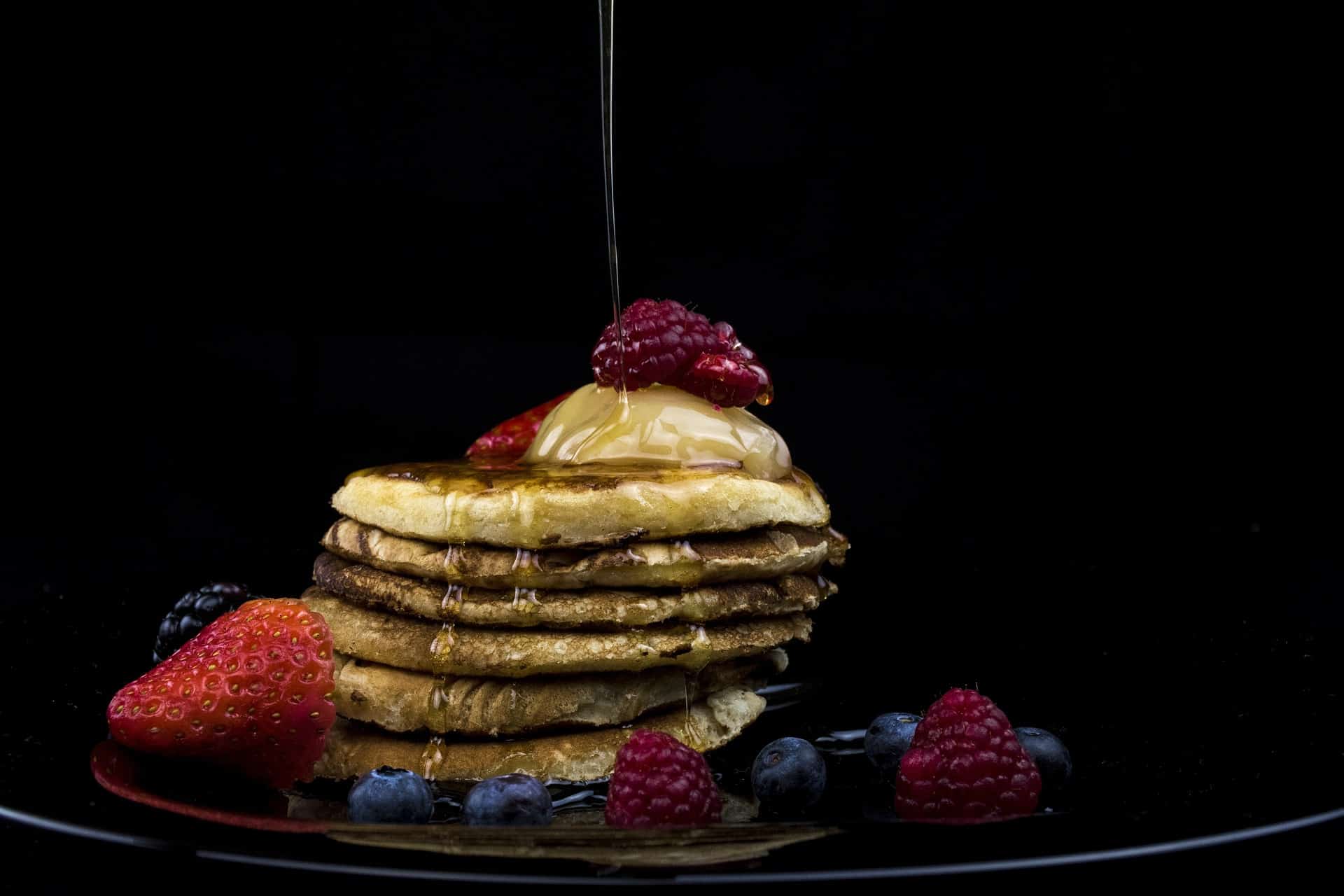 pancakes with berries and syrup